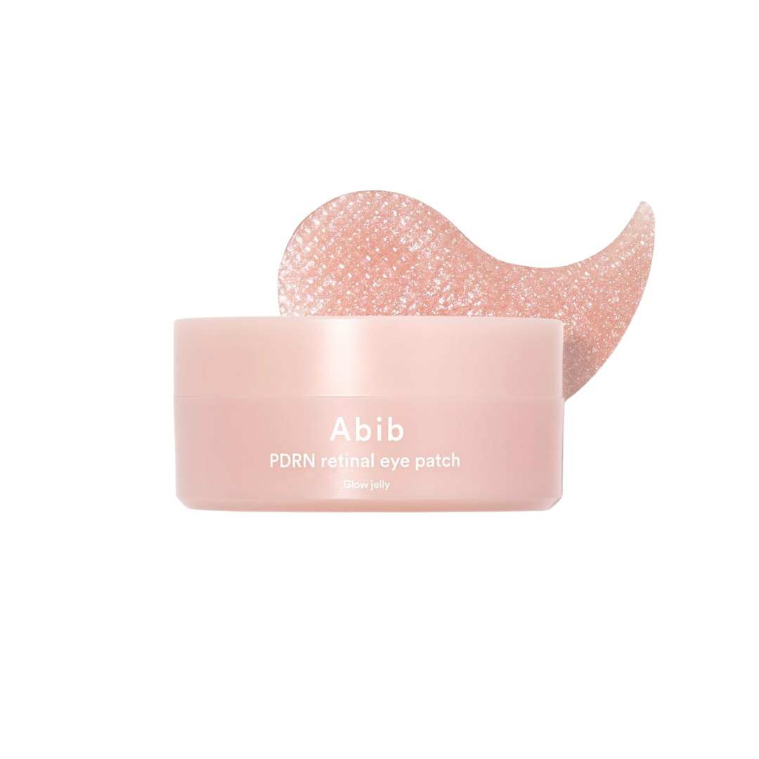 ABIB PDRN Retinal Eye Patch Glow Jelly is a soothing and revitalizing hydrogel eye patch designed to brighten and firm the delicate under-eye area. Enriched with Niacinamide, Caffeine, and Retinal, it targets dark circles and fine lines while Sodium DNA (a form of PDRN) supports skin regeneration. With Collagen, Squalane, and Sodium Hyaluronate, it delivers lasting hydration, and calming botanicals like Centella Asiatica help reduce puffiness. The jelly texture adheres comfortably, leaving the skin around t