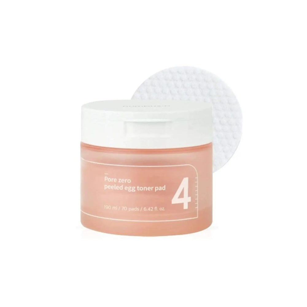 NUMBUZIN No. 4 Pore Zero Peeled Egg Toner Pad is designed to refine pores and smooth skin texture for a clear, flawless complexion. Infused with Gluconolactone (PHA) and Capryloyl Salicylic Acid (LHA), these pads gently exfoliate dead skin cells, unclog pores, and promote a brighter, more even skin tone. Enriched with hydrating ingredients like Sodium Hyaluronate, Panthenol, and Betaine, they ensure your skin stays moisturized and balanced. The added botanical extracts, including Evening Primrose and Pine L