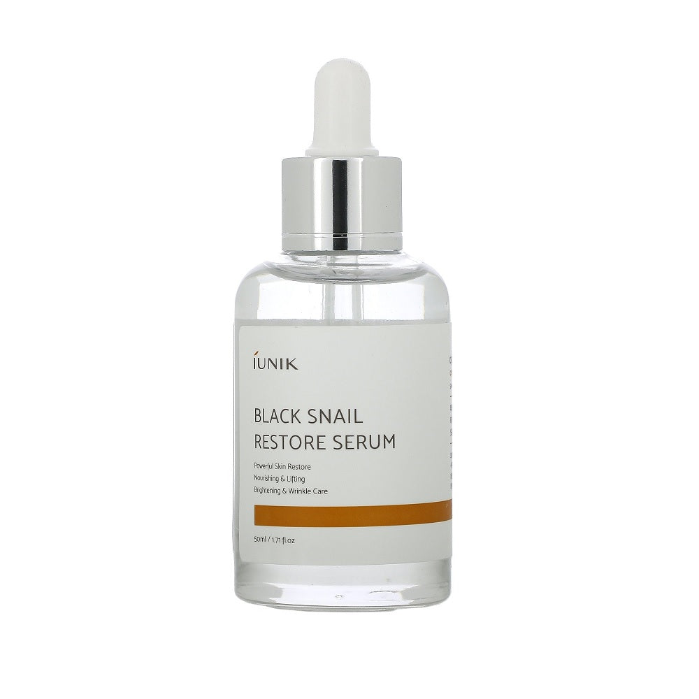IUNIK Black Snail Restore Serum is a nourishing serum enriched with Snail Extract and Centella Asiatica Leaf Water to repair and rejuvenate the skin. Its hydrating formula helps improve elasticity, reduce redness, and promote a smoother, more radiant complexion. Infused with botanical extracts like Green Tea, Chamomile, and Rosemary, it soothes and calms irritation while providing antioxidant benefits. Ideal for all skin types, this serum supports skin recovery and leaves it feeling refreshed and revitalize