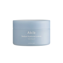 Load image into Gallery viewer, ABIB Sedum Hyaluron Creme Hydrating Pot is an intensely hydrating moisturizer designed to quench thirsty skin. Featuring a rich blend of Hyaluronic Acid in multiple forms, it deeply moisturizes and locks in hydration for lasting suppleness. Ingredients like Sedum Sarmentosum Extract and Centella Asiatica Leaf Extract soothe and repair the skin, enhancing its resilience. Macadamia Oil and Ceramide NP strengthen the skin&#39;s barrier, preventing moisture loss. Ideal for daily use, this cream leaves skin soft, sm