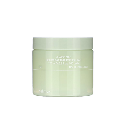 CELIMAX Ji Woo Gae Heartleaf BHA Peeling Pad is a gentle exfoliating pad designed to smooth and clarify the skin. Formulated with Betaine Salicylate (BHA), it helps remove dead skin cells and unclog pores, while Heartleaf Extract, Tea Tree, and Green Tea Water calm and refresh the skin. Enriched with Sodium Hyaluronate and Centella actives, these pads provide hydration and soothing care, leaving skin soft, clear, and balanced with every swipe.