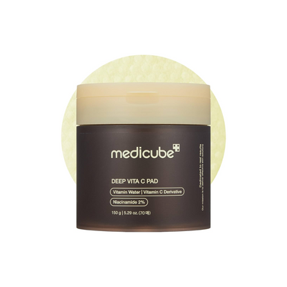 MEDICUBE Deep Vita C Pad is a radiance-boosting toner pad soaked in Vitamin C, Niacinamide, and Sea Buckthorn Water to brighten dull skin and improve overall tone. Infused with soothing plant extracts and Hyaluronic Acid, it gently exfoliates with PHA (Gluconolactone) while delivering deep hydration. Perfect for targeting dark spots, uneven texture, and tired-looking skin, leaving your complexion fresh, smooth, and glowing.