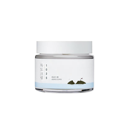 ROUND LAB 1025 Dokdo Cream is a deeply moisturizing and soothing cream formulated to strengthen the skin barrier and restore hydration. Enriched with Ulleungdo deep sea water, Ceramides, and multiple forms of Hyaluronic Acid, it helps lock in moisture while supporting skin barrier health. Added ingredients like Panthenol, Allantoin, and Beta-Glucan calm irritation and promote a smooth, supple complexion. Ideal for dry, sensitive, or dehydrated skin.
