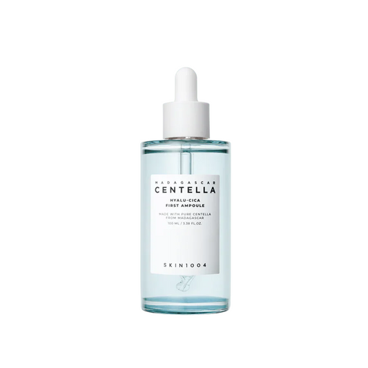 SKIN1004 Madagascar Centella Hyalu-Cica First Ampoule is a soothing and hydrating starter serum made with 92% Centella Asiatica Extract to calm and strengthen sensitive skin. Infused with Hyaluronic Acid and Niacinamide, it delivers deep moisture and brightens the complexion. Lightweight and fast-absorbing, it preps the skin for the rest of your routine, leaving it soft, balanced, and refreshed. Perfect for all skin types, especially sensitive or dehydrated skin.