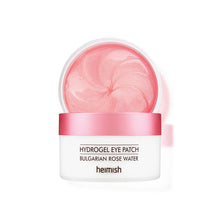 Load image into Gallery viewer, HEIMISH Bulgarian Rose Water Hydrogel Eye Patch is a soothing and hydrating treatment for the delicate under-eye area. Infused with Rosa Damascena Flower Water and Niacinamide, it brightens and revitalizes tired eyes while reducing the appearance of dark circles. Enriched with Centella Asiatica Extract and Sodium Hyaluronate, these hydrogel patches deliver deep hydration and a calming effect. Perfect for daily use or a quick skin refresh, they leave your under-eye area feeling smooth, nourished, and visibly